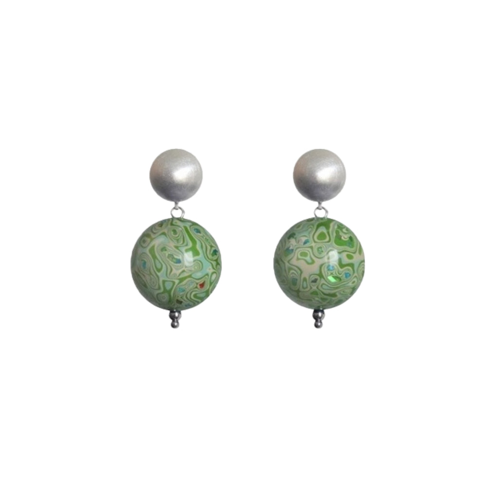 Pair of earrings with green marbled beads and silver tops on a white background