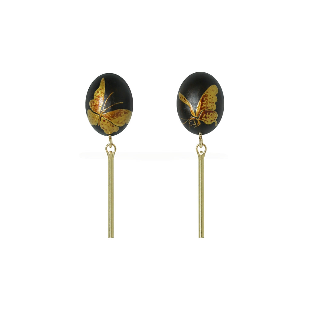 Pair of earrings with butterfly design on black stones and gold hooks on a white background LacLume Hand-Painted Lacquer Earrings Gold Butterfly Glamour Understated Elegance