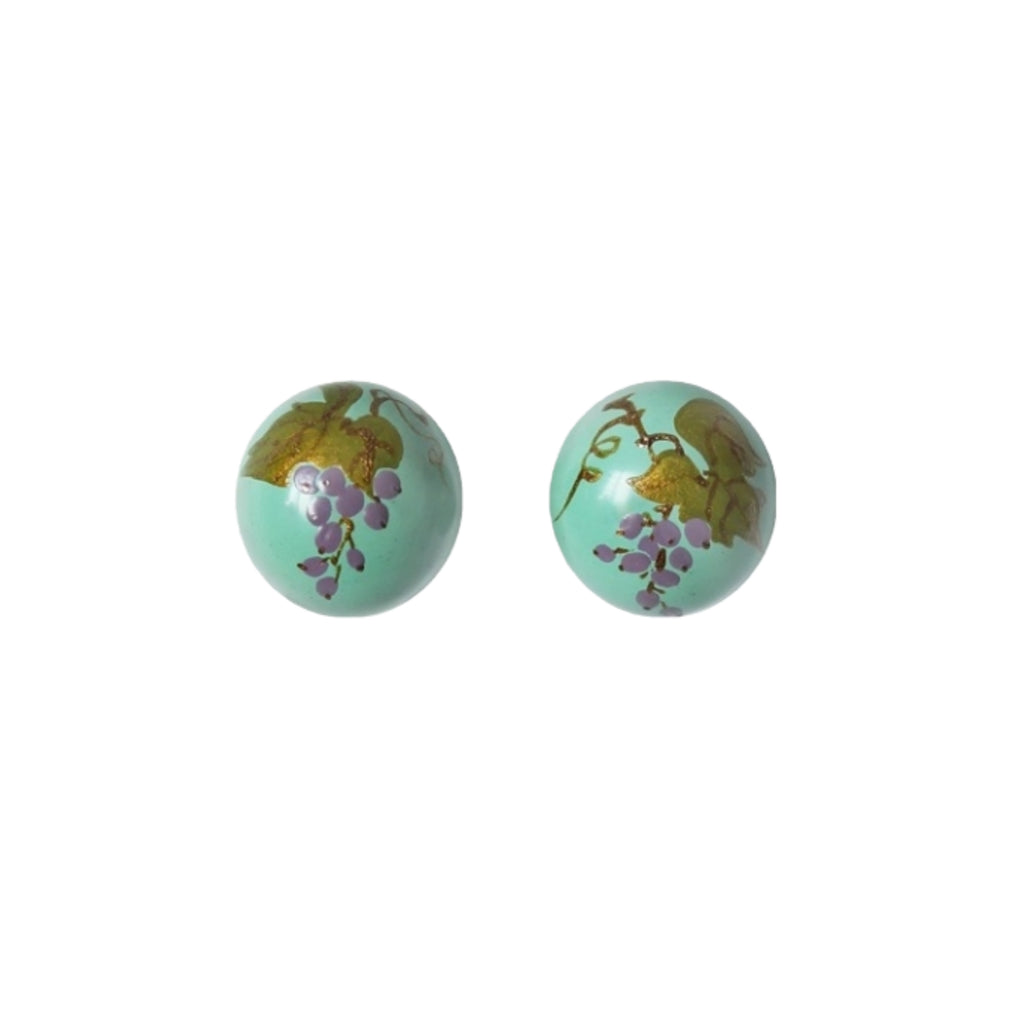 Pair of round earrings with floral design on a white background