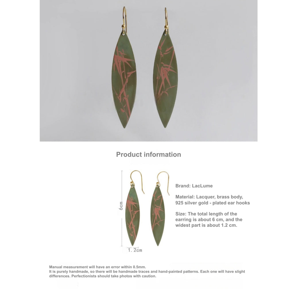 Green leaf-shaped earrings with red patterns on a gray background, featuring product information text.