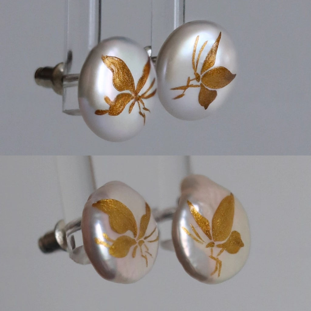 Pair of cufflinks with gold leaf design on a white background LacLume Hand-Painted Lacquer Earrings Baroque Pearl Gilded Butterfly