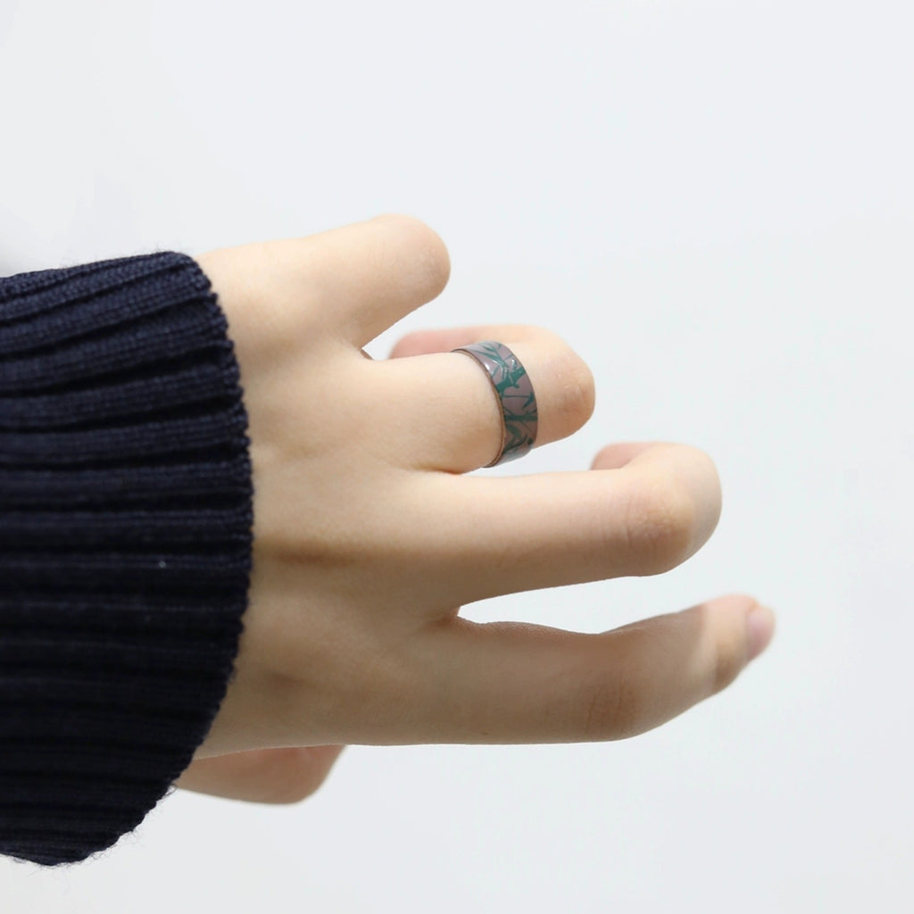 Hand wearing a black ring on a white background LacLume HandPainted Lacquer Silver Ring Bamboo Pattern Handmade Silver Lacquerware