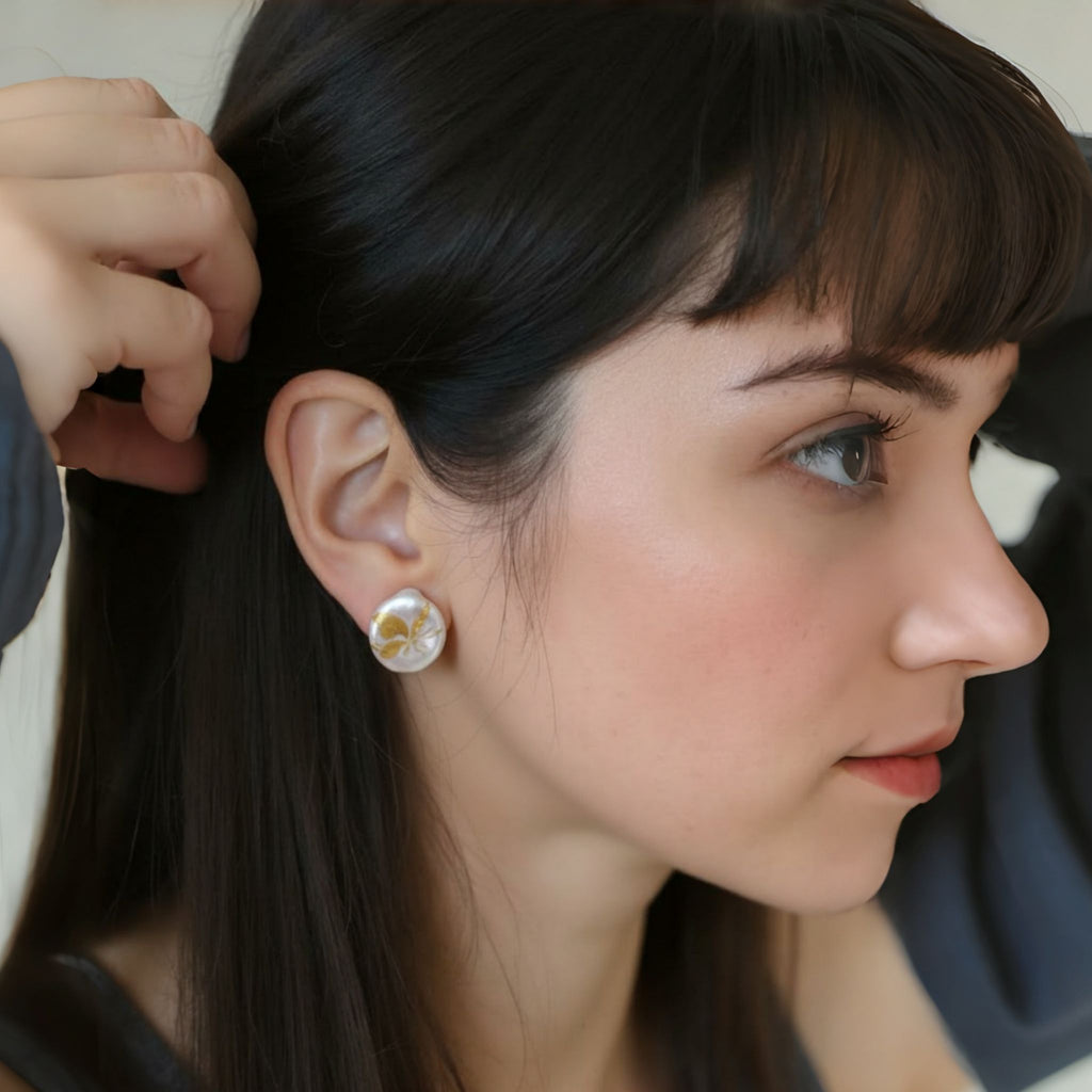 Woman wearing a floral earring with a blurred background