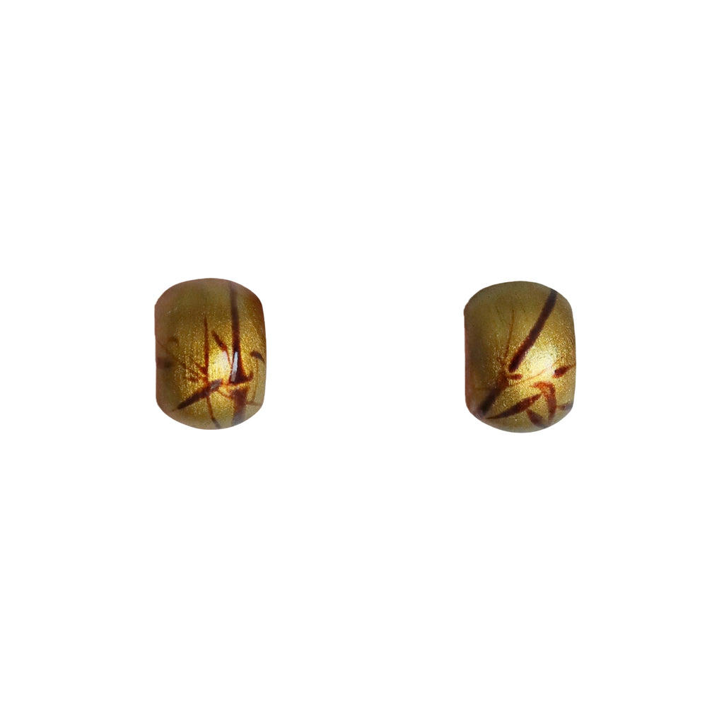 Pair of gold earrings with a white background