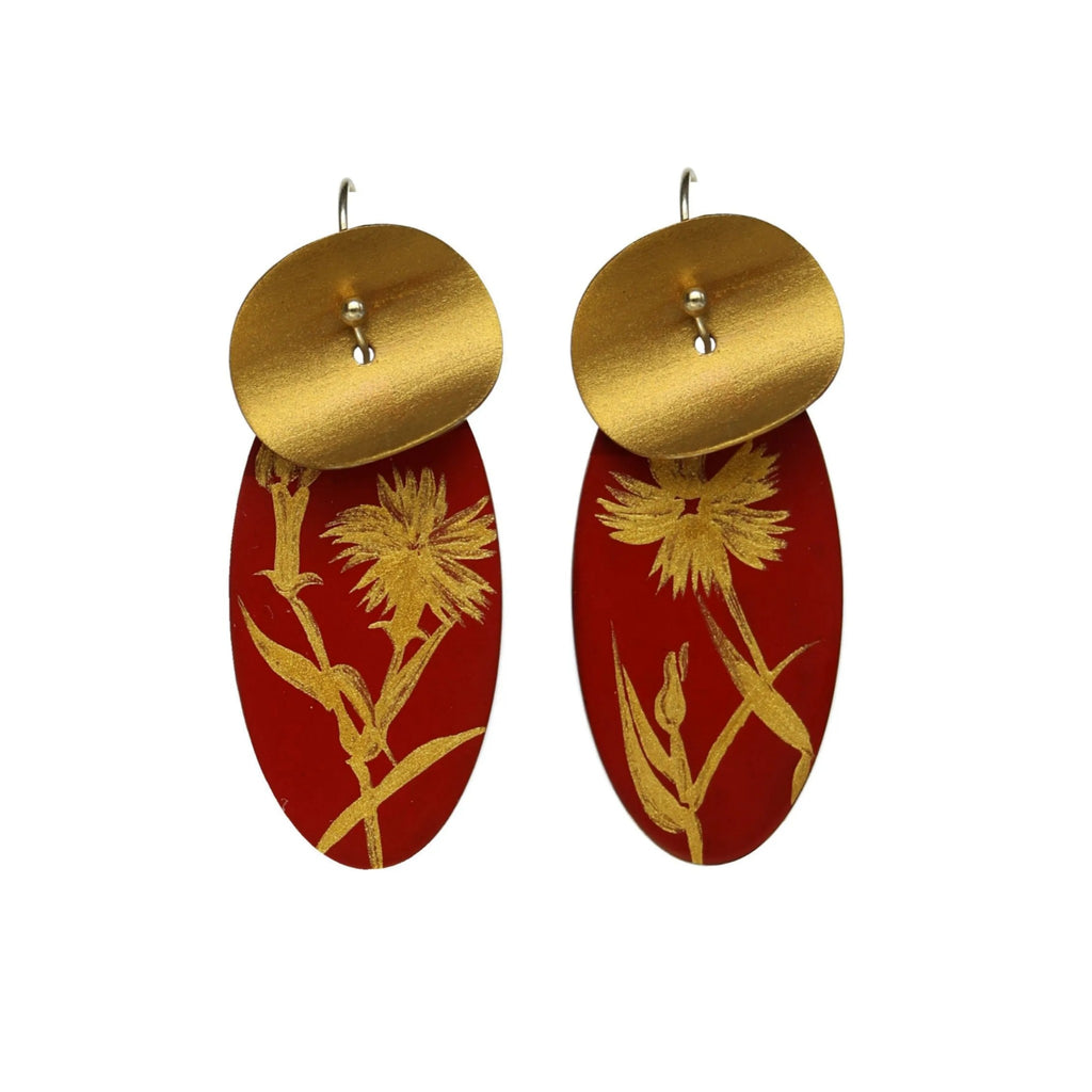 Gold and red earrings with floral design on a white background