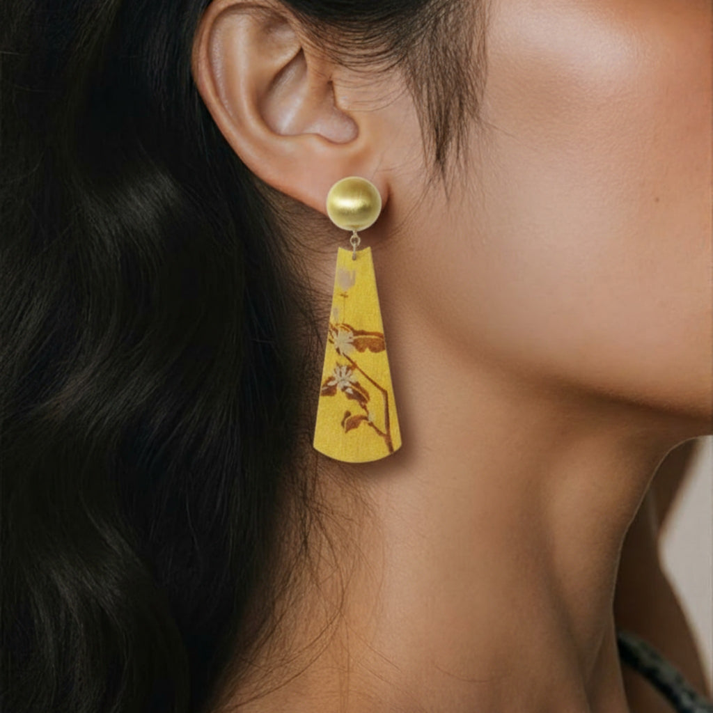 Yellow earring worn by a person with dark hair.LacLume Earrings Summer Jasmine Plant Pattern Jewelry Handmade Lacquer Jewelry